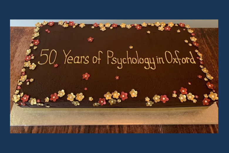 Photograph of a birthday cake with '50 Years of Psychology in Oxford' written in icing